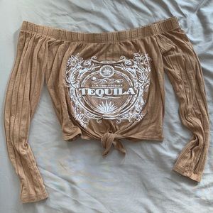 Woman’s off the shoulder cropped top.